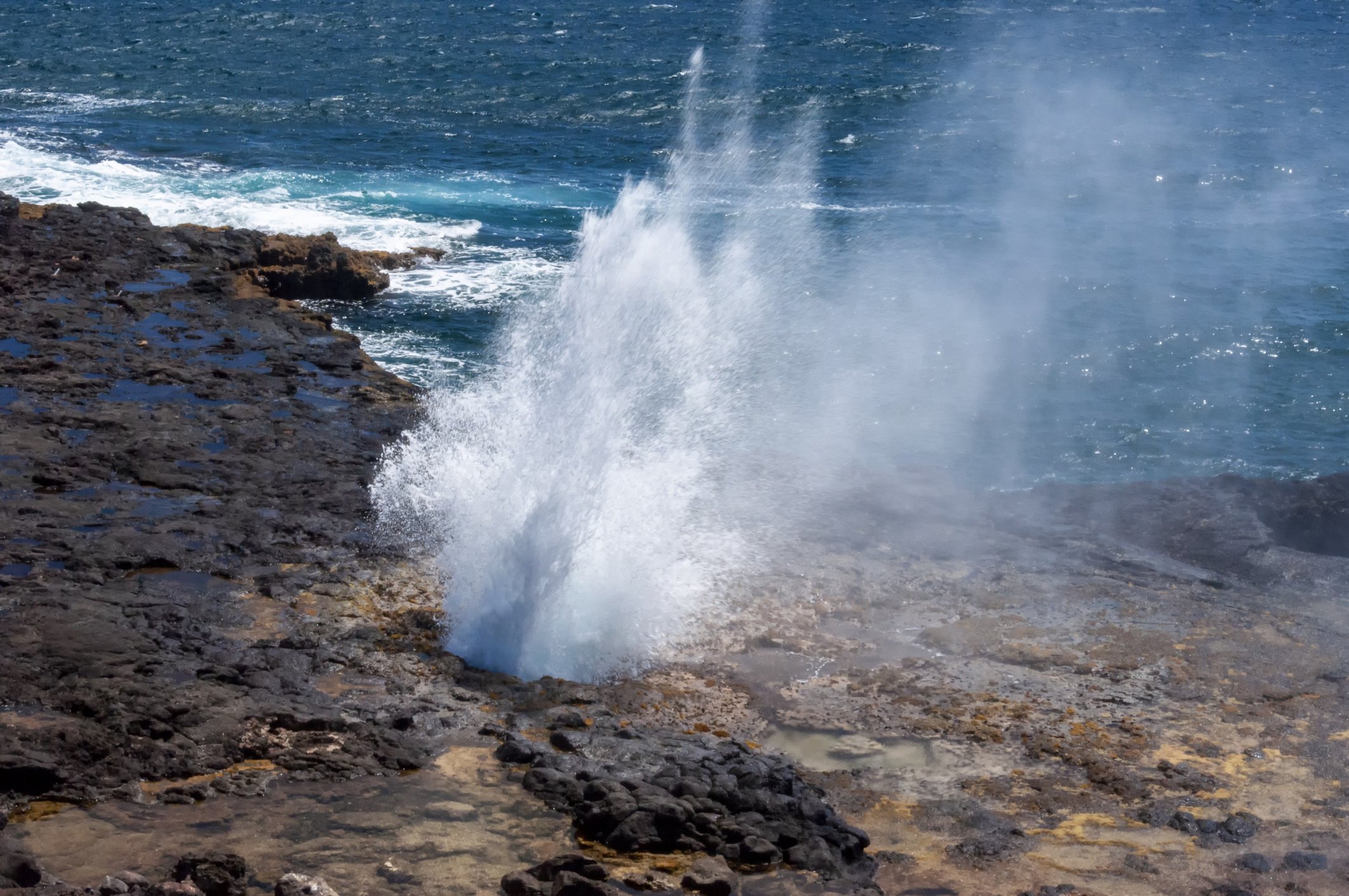 Powerful blow hole on Kauai, Hawaii.