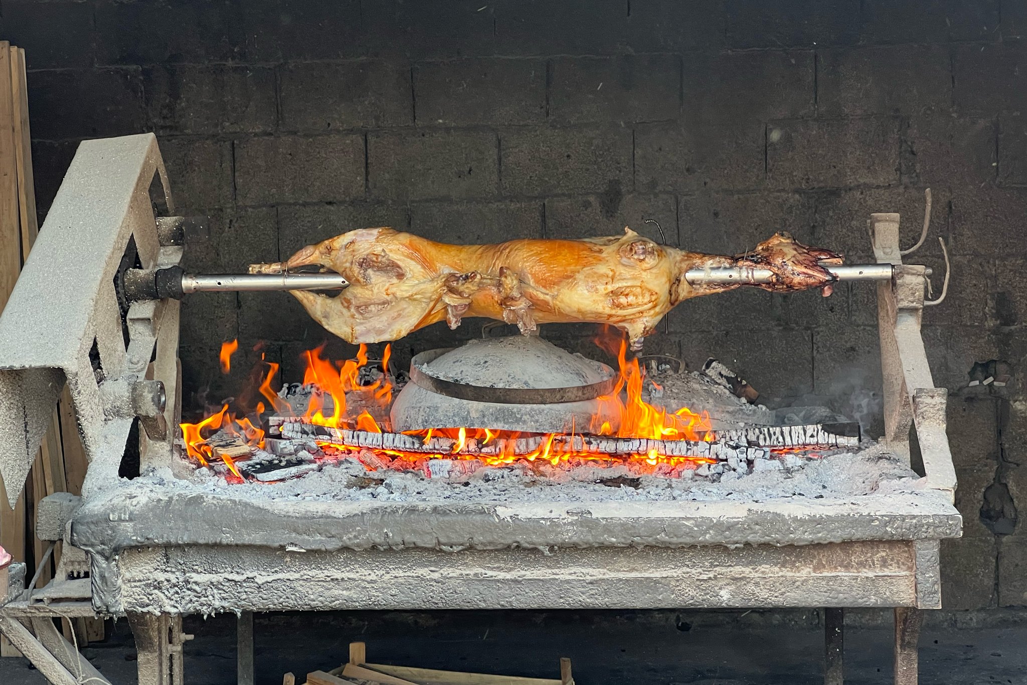 roamfreerebecca-roasted-pig-over-fire-peka-zadar-croatia-europe-world-trip-drone-0808
