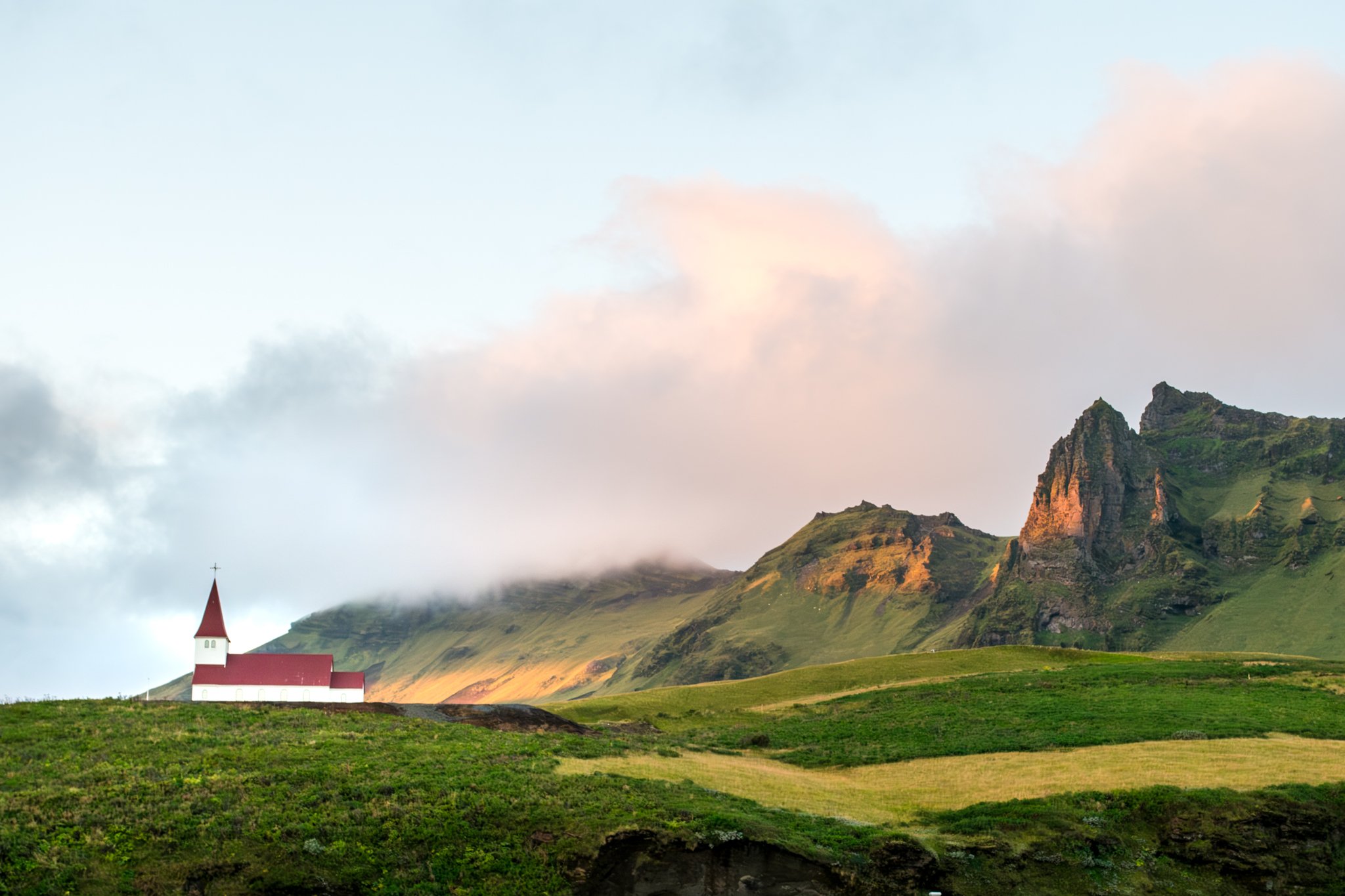 Church at sunset on the hills above Vik, Iceland